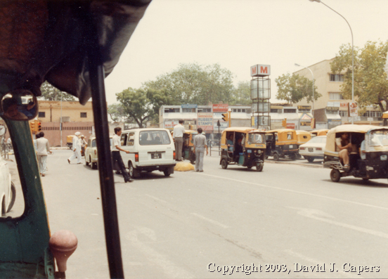 Three wheeling into an intersection with the Connaught Place circle of 1985.